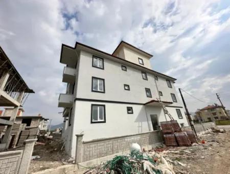 Apartment For Sale In Ortaca Karaburun Neighborhood With Pool For 1 1 Investment.