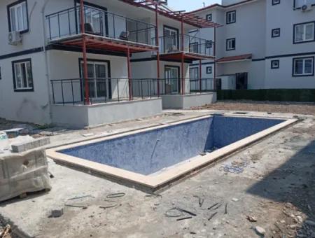 1 1 Large Apartment For Sale In Ortaca Karaburun Pool Site