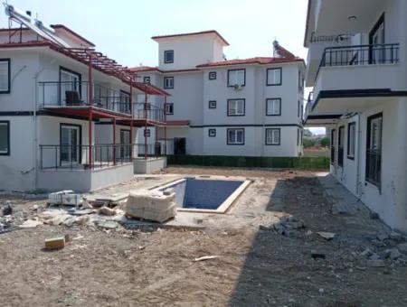 1 1 Large Apartment For Sale In Ortaca Karaburun Pool Site